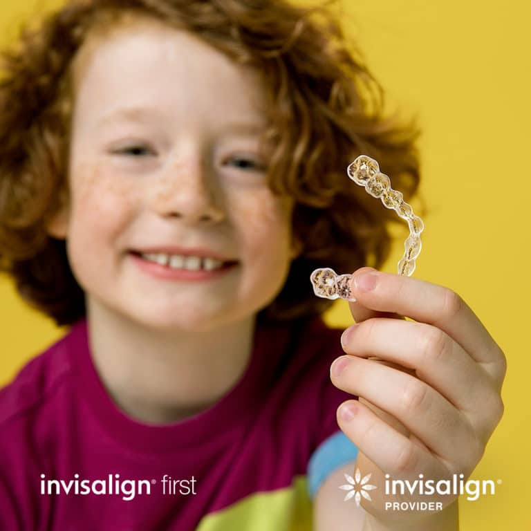 Kid with Invisalign brace