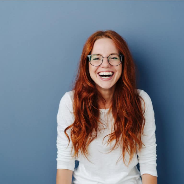 Girl laughing with Invisalign brace 